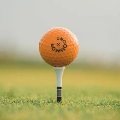 Uncommon Model 55 Golf Ball - Electric Orange / Dozen -Ace Golf Clubs Store uncommon model 55 golf ball electric orange